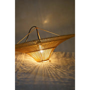 Natural woven rattan lamp shade at night. Collectiviste  lighting UK