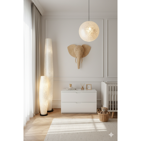 Rattan elephant head in white nursery setting with cute shell lamps