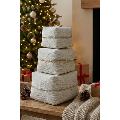 White boxes in front of Christmas tree