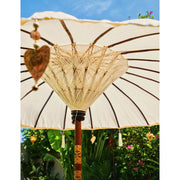 Handcrafted cream parasol detail with heart tassels in su