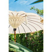 Close-up of cream parasol canopy showing natural cream hue and texture