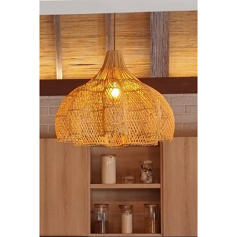 Lacey rattan lamp shade hanging in wooden kitchen by Collectiviste lighting UK.
