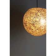 Gold ceiling shade made from oyster shells.