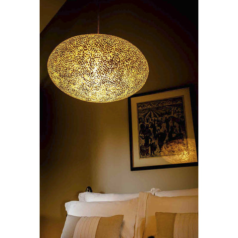 Gold Ceiling Light suspended over bed. Natural shell lighting by Collectiviste.