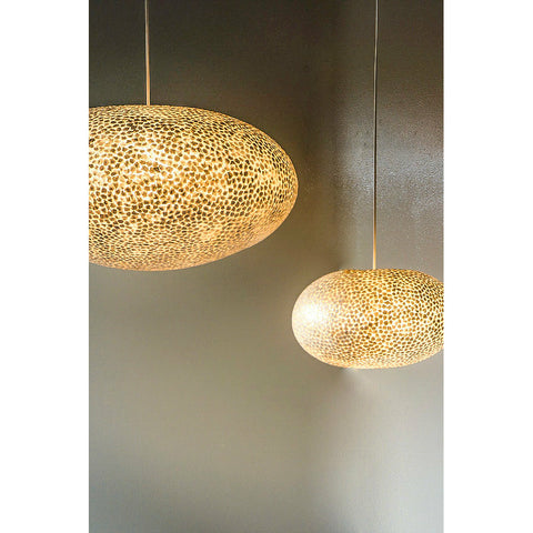 Stunning mother of pearl pendant lighting display. Elara ceiling lamp shades by Collectiviste.