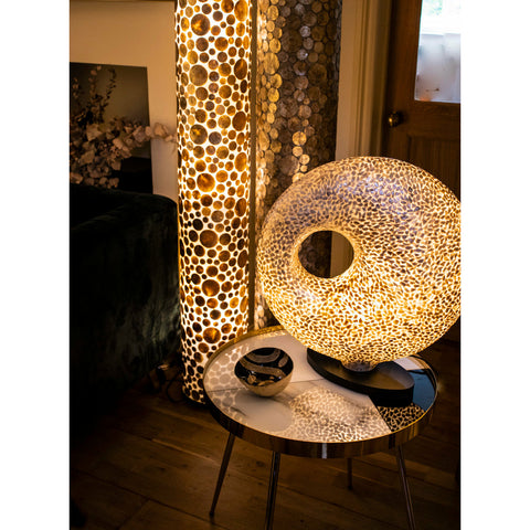 Gold table lamp in unique torus shape. Handcrafted with gold shells by Collectiviste.