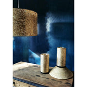 Gold shell ceiling shade and table lamps.