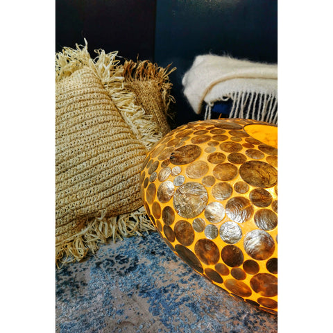 Naturally inspired interiors - sisal cushions and shell lamp shade.