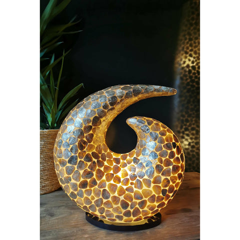 Gold swirl lamp makes standout shelf decor.