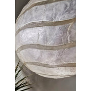 Handcrafted lamp shade using shell pieces. Shell lighting by Collectiviste..