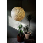 Large white pendant light shade made from mother of pearl. Natural lighting design solutions by Collectiviste UK.