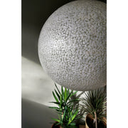 Large ceiling shade decorated with white mother of pearl fragments. Biophilic lighting design by Collectiviste.