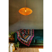 Natural rattan lampshade in modern living room. Handcrafted lighting by collectiviste.com