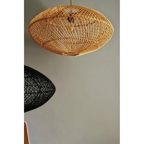 Close up of black and natural rattan lampshades in a modern oval shade. Handcrafted lighting by collectiviste.com