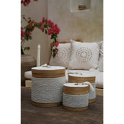 Natural bamboo and white bead trinket boxes in beautiful white villa.