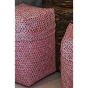 Close up of hand painted pink storage baskets made from eco-friendly bamboo.