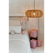 Star shaped rattan light and Pink storage baskets and accessories in girls bedroom. Decor by Collectiviste.