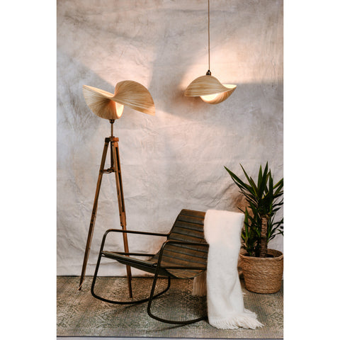 Large bamboo tripod floor lamp and bamboo ceiling pendant beside green leather rocking chair. Kyoto bamboo lighting collection by Collectiviste.