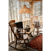 Woodland veranda design. Rattan lampshade and handwoven cushions by Collectiviste.