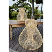 Medusa rattan lampshades in two sizes on tropical deck.