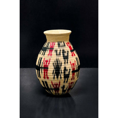 Large Werregue basket woven from natural palm with black and red motif. Sold by Collectiviste UK.